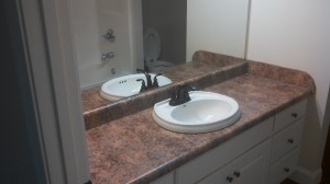 Bathroom Sink And Vanity With Large Mirror